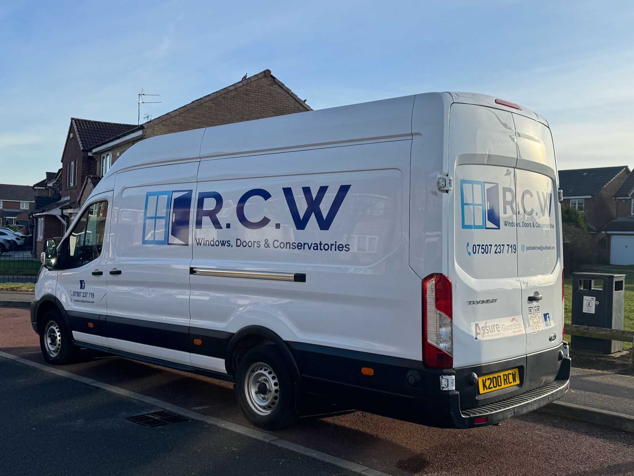 White van with R.C.W Windows, Doors & Conservatories livery and phone number